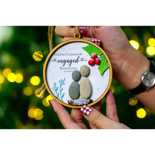First Christmas engaged ornament for couple under cherry tree by Dovaart.com