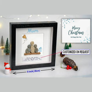 Handmade Pebble Art Children Embracing Mother Inside a Snowy Floral Scene by Dovaart.com